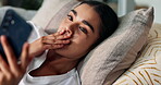 App, phone and surprise with woman on sofa in living room of home for alert or communication. Gossip, social media and wow of shocked person in apartment with gasp reaction to news or notification