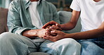 Crying, holding hands or empathy and people in home together with support for grief, loss or pain. Love, sadness and trust with friends closeup on sofa in apartment for compassion, help or patience