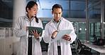Scientist, night and talking with tablet in lab for pharmaceutical review, medical research or innovation. Comparison, people and clinical analysis for studying science data, teamwork and results