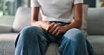 Anxiety, psychology and person fidgeting with hands on sofa with stress or emotions in living room at home. Mental health, worry and leg shake for panic attack with phobia, overthinking or fear.
