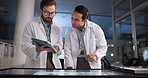 Scientist, men and technology with tablet in laboratory for pharmaceutical review, medical research or innovation. Night, people and interactive display for studying science data, teamwork or results