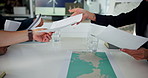 Documents, map and windmill with hands of business people in meeting for renewable energy, location and idea. Planning, sustainability and eco friendly launch with employees in agency for development