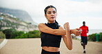 Fitness, woman and stretching arms outdoor for cardio warm up, start running or workout performance. Thinking, girl runner or getting ready for muscle strength, race preparation and marathon exercise