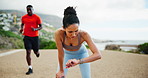 Break, runner and woman with smart watch, outdoor and exhausted by exercise in morning, active and running. Tired, athlete and person with fatigue on race, breathing and checking time for marathon