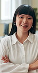 Face, business and Asian woman in office, arms crossed and smile with professional, fashion designer and pride. Portrait, happy person and entrepreneur with creativity, career ambition and growth