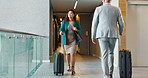 Suitcase, walking and woman travel for business, conference and industry workshop. Convention center, journey and entrepreneur person in hotel lobby for seminar, corporate pride and career trip