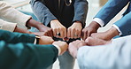 Fist bump, huddle and business people in office with unity, collaboration and teamwork. Solidarity, connection and group of coworkers with hands together for synergy, trust and bonding in meeting.