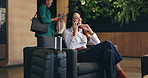 Business, luggage and phone call with woman in airport lobby for mobile communication or planning. Chair, suitcase and thinking with happy mature employee in conversation for negotiation or update
