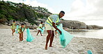 Volunteer, cleaning or man at beach with trash bag, teamwork or sustainability on Earth day. Climate change, person or people at ocean with plastic collection, waste management or seaside environment