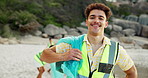 Face, beach and man with trash bag, recycle and sustainability with earth day, rubbish and environment. Portrait, happy person and volunteer with plastic collection, climate change and ocean