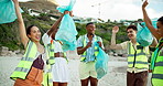 Face, huddle and litter with friends on beach for cleaning, conservation or environmentalism. Charity, recycling and team building with happy people on coast for achievement, activism or success