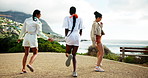 Running, beach and back of girl friends on vacation, adventure or holiday with happiness. Excited, jumping and women having fun by ocean for weekend trip with freedom, bonding or getaway connection.