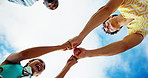 Fist bump, people and team with support together, clapping or celebrate success with motivation. Happy, friends and hands for community, collaboration and applause for connection in low angle outdoor