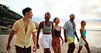 Holiday, talking and friends walking on beach for adventure and bonding together on tropical island. Happy people, sea and group on trip outdoor at ocean for summer vacation, travel and laughing