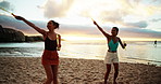 Happy, women and fun with bubbles on beach of playful games, travel reunion and bonding together. People, friends and spin with wand for freedom activity, tropical island and social gathering of trip