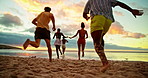 Running, sunset and back of friends on beach for holiday, vacation and weekend together. Nature, excited group and men and women in ocean, sea and waves for adventure, freedom and travel outdoors