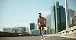 Athlete, fitness and man with running in road for marathon training, cardio exercise and performance pace. Person, runner and race challenge on bridge for wellness competition, morning jog or workout