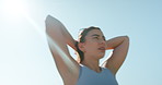 Woman, fitness and tired with sweat, outdoor and low angle with sky, break and breathing in summer. Girl, exhausted and fatigue with burnout, rest and training to prepare for marathon in Argentina