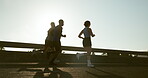 Fitness, people and group with running on bridge for marathon training, exercise and race performance. Sunlight, runner club and cardio in road for wellness competition, morning jog and workout pace