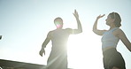 Active, couple and high five for fitness in city for success, exercise support and team celebration. Tired, people and and running recovery with sports achievement, performance and marathon practice