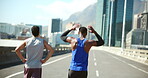 Runner, friends and men in morning, break and routine for wellness on road, walking and fitness in city. Outdoor, athlete and people on street for exercise, back and healthy for sports with workout