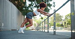 Fitness, training and woman stretching in city, getting ready for exercise or workout for cardio. Runner, road and warm up with confident young athlete in urban town for sports and marathon goals