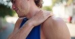Fitness, injury and man with shoulder pain outdoor for workout accident, massage muscle tension and tender joint. Male athlete, exercise and strain with inflammation and training mistake on sidewalk