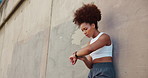 Outdoor, woman and tired with smart watch for fitness, check time or wellness progress for workout. African female person, breathing and exhausted with clock for heart rate, health stats or low angle
