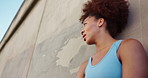Woman, fitness and tired athlete outdoor with exercise break, breathing and running recovery. Runner, african person or rest with low angle for cardio challenge, marathon race and workout performance