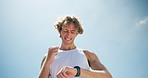 Outdoor, success and man with smart watch, fitness and challenge with blue sky, wellness and exercise. Healthy person, break or runner with training, check time or progress with space and achievement
