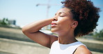 African woman, tired and fitness in city, eyes closed or break for training, breathe and fatigue. Person, girl and rest with exercise, workout or prepare for marathon with burnout on bridge in Kenya