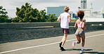 People, back or running in city for fitness, cardio challenge or endurance workout for wellness. Urban, friends or active on road for practice, exercise or training for marathon or muscle development