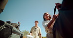 Couple, luggage and trunk of car for travel, holiday or vacation preparation outdoor. Man, woman or loading suitcase in vehicle, transport or truck bed for road trip adventure or journey in low angle