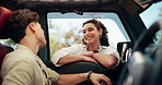 Man, woman and talking on road trip by car window, happy and bonding with love, excited and connection. Couple, smile and conversation by vehicle, transport and together for journey on vacation