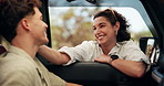 Couple, talking and road trip by car window, happy and bonding with love, excited and connection. Man, woman and smile with conversation by vehicle, travel and together for journey on vacation