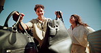 Couple, suitcase and trunk of car for road trip, travel or vacation preparation outdoor. Man, woman or loading luggage in vehicle, transport or truck bed for holiday adventure or journey in low angle