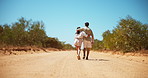 Hug, countryside or couple with love, back or romantic relationship for outdoor date. Nature, walking or man with woman, care and vacation for holiday travel, safari adventure or bonding together