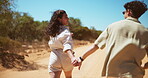 Running, holding hands and couple in desert, outdoor and escape together for love, talking and location. Travel, man and woman with smile for journey, romance and adventure for people in nature