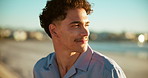 Man, smile and sunset at beach with thinking, relax and fresh air with travel. Person, happy and face at ocean with peace, vacation break and reflection for mindfulness with space at seaside