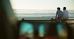 People, back and relax at promenade for travel, conversation and outdoor break on road trip. Men, friends and talking at ocean for ride planning, sharing memories and sunset on holiday with sea space
