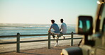 Friends, back and relax at promenade for travel, conversation and outdoor break on road trip. Men, people and talking at ocean for ride planning, sharing memories and sunset on holiday with sea space