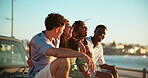 Beach, car and couple of friends with laughing for travel adventure, sightseeing nature and journey break. Happy, people and holiday road trip on promenade for bonding, funny conversation or sea view