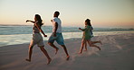Running, beach and friends with vacation, back and travel with cardio, bonding together and excited. People, seaside and men with women, ocean and happiness with nature, summer holiday and Zanzibar