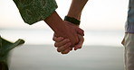 Beach, holding hands and couple with vacation, love and bonding together with unity. Closeup, seaside and people with romance, relationship and tropic island with weekend break, marriage and Zanzibar