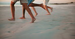 Beach, excited and feet of friends running on sand together for bonding, holiday or vacation closeup. Adventure, energy and travel with group of people outdoor on coast at ocean or sea for getaway 