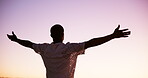 Back, man and sunset  with freedom outdoor for summer vacation, travel and celebration. Male person, arms spread and holiday adventure, calm morning and weekend break with getaway achievement of trip