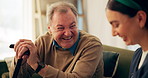 Nurse, home and laughing with senior man for funny joke, help and support. Medical, happy caregiver or talking to patient with disability, cane and rehabilitation for geriatric healthcare or wellness
