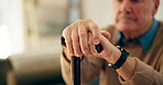 Walking stick, hands and old man with disability in home, healthcare and rehabilitation from stroke. Nursing house, senior person and closeup with cane for balance support, recovery and osteoporosis