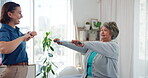 Physiotherapy, resistance band and stretching with old woman in clinic for consulting, help or fitness. Support, physical therapy and healing with patient in office for rehabilitation and advice