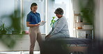 Consulting, physiotherapy and checklist with old woman in clinic for medical history, advice and healing. Discussion, treatment plan and rehabilitation with patient and doctor in office for health